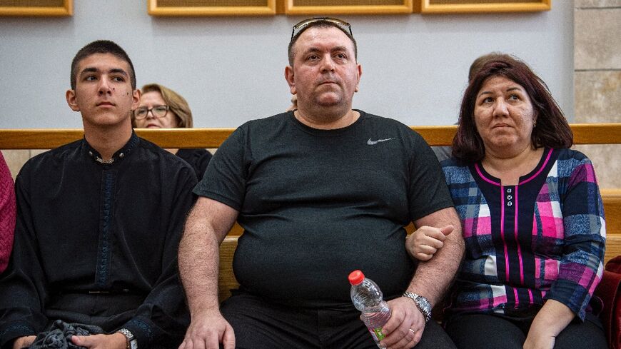Roman Zdorov (C) burst into tears when the court freed him more than 16 years after he was first imprisoned over a schoolgirl's murder