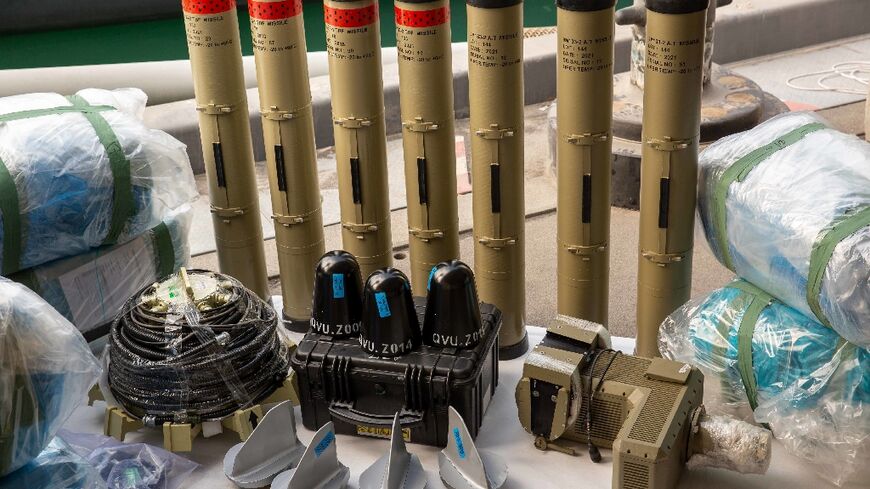 The US Navy displays weapons it says were seized from the intercepted vessel, including Iranian versions of Russia's Kornet anti-tank missile and medium-range ballistic missile components