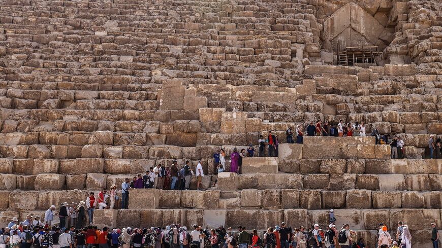 Tourists queue to visit the Great Pyramid of Khufu (Cheops) on Thursday as the discovery was announced