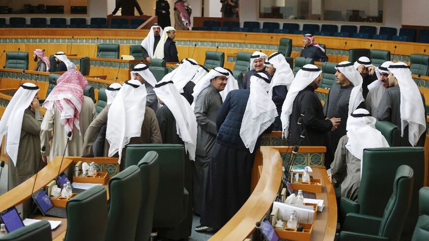 Kuwaiti parliament members attend a session of the National Assembly 