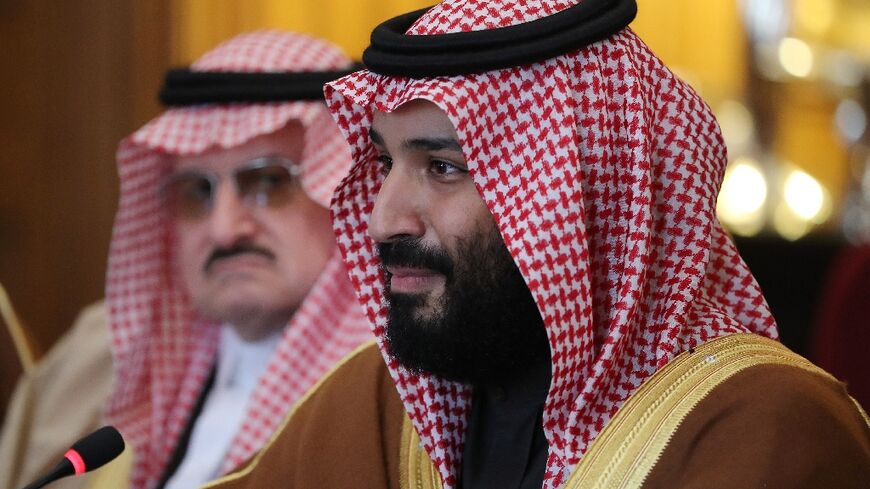 Saudi Arabia's Crown Prince Mohammed bin Salman (R) dramatically threatened to acquire a nuclear weapon if Iran 