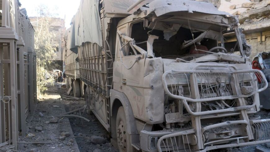 A picture provided by the official Syrian news agency show the carcass of a truck in the eastern city of Deir Ezzor where a war monitor reported a deadly drone attack targeting an arms factory belonging to Iran-backed group 