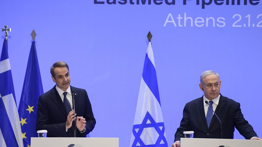 Greek Prime Minister Kyriakos Mitsotakis (L) speaks during a press conference with Israel's Prime Minister Benjamin Netanyahu (R) in Athens on January 2, 2020 following the signing ceremony of an agreement for the EastMed pipeline project designed to ship gas from the eastern Mediterranean to Europe in Athens on January 2, 2020. (Photo by ARIS MESSINIS / AFP) (Photo by ARIS MESSINIS/AFP via Getty Images)