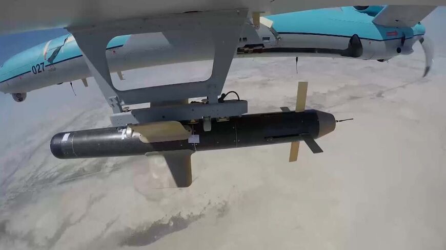 A handout picture provided by the Iranian Army's official website on September 11, 2020, shows an Iranian Simorgh drone carrying a weapon during the second day of a military exercise in the Gulf, near the strategic strait of Hormuz in southern Iran. - The Iranian navy began on September 10 a three-day exercise in the Sea of Oman near the strategic Strait of Hormuz, deploying an array of warships, drones and missiles. One of the exercise's objectives is to devise "tactical offensive and defensive strategies 