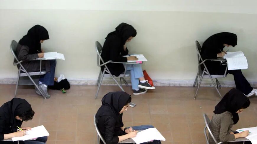 Iranian high school students sit for their university entrance examination in Tehran on June 25, 2009. 