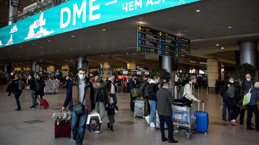 Passengers are seen at Moscow's Domodedovo airport, the day S7 Airlines canceled all its international flights due to sanctions imposed on Russia over the country's invasion of Ukraine, March 5, 2022.