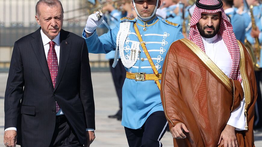Turkey's President Recep Tayyip Erdogan (L) reviews the honour guard as he welcomes Crown Prince of Saudi Arabia Mohammed bin Salman (R) during an official ceremony at the Presidential Complex in Ankara, on June 22, 2022.  (Photo by ADEM ALTAN/AFP via Getty Images)