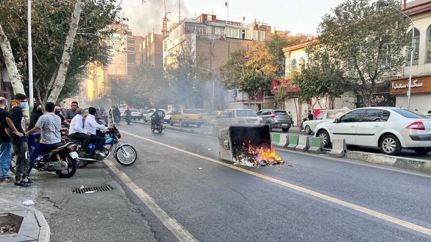 A picture obtained by AFP outside Iran, reportedly shows a garbage container on fire in the capital Tehran on October 8, 2022. - Iran has been torn by the biggest wave of social unrest in almost three years, which has seen protesters, including university students and even young schoolgirls chant "Woman, Life, Freedom". (Photo by -/AFP via Getty Images)