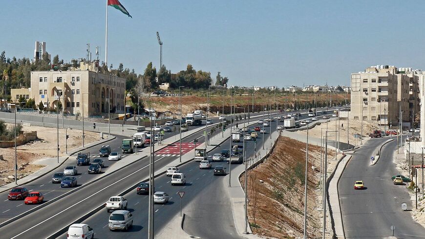 Vehicles drive in Amman on February 22, 2023. (Photo by Khalil MAZRAAWI / AFP) (Photo by KHALIL MAZRAAWI/AFP via Getty Images)