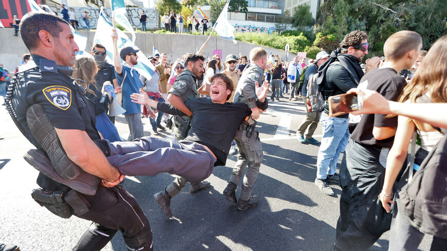  Israeli forces disperse a protest against the government's controversial judicial reform bill in Tel Aviv on March 9, 2023.  (Photo by JACK GUEZ/AFP via Getty Images