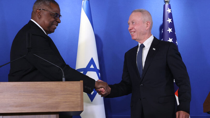 Israeli Minister of Defence Yoav Gallant (R) and US Secretary of Defense Lloyd Austin shake hands after delivering a statement to the press at the Israel Aerospace Industries (IAI) headquarters near the Ben Gurion airport in Tel Aviv, on March 9, 2023. 
