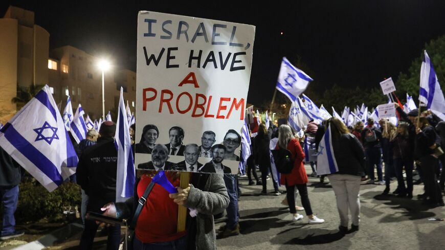 Israelis protest against the government's controversial judicial reform bill, in front of the residence of Justice Minister Yariv Levin, in the central city of Modiin, on March 9, 2022. (Photo by GIL COHEN-MAGEN / AFP) (Photo by GIL COHEN-MAGEN/AFP via Getty Images)