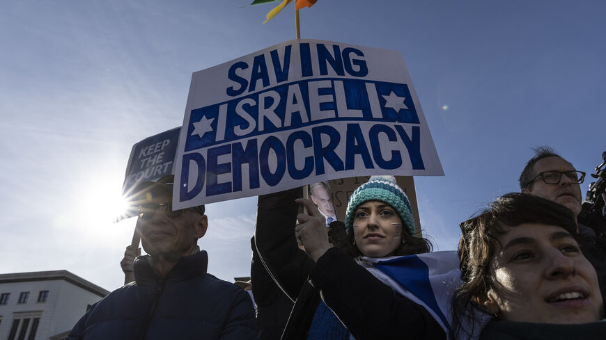 People demonstrate at the Brandenburg Gate during the visit of Israeli Prime Minister Benjamin Netanyahu against possible legislation in Israel that would undermine the role of Israel's Supreme Court, Berlin, Germany, March 16, 2023.