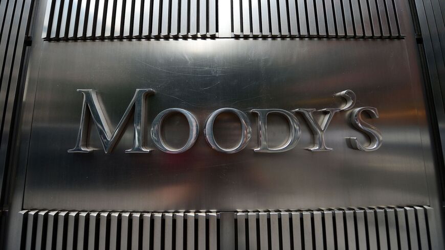 A sign for Moody's rating agency is displayed at the company headquarters in New York, on Sept. 18, 2012. 