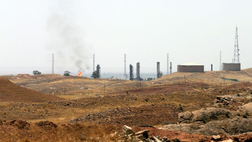 A view of an oil refinery in the Iraqi city of Kirkuk, on June 20, 2014. Kurdish forces took control of Kirkuk and other disputed territory as Sunni Arab militants pressed an offensive that has seen them seize a large chunk of Iraq and sweep federal security forces aside. AFP PHOTO/KARIM SAHIB (Photo by KARIM SAHIB / AFP) (Photo by KARIM SAHIB/AFP via Getty Images)