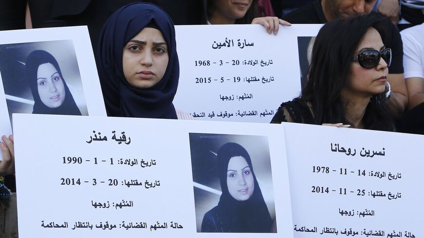 Lebanese women hold placards during a protest organized by civil society groups and activists.