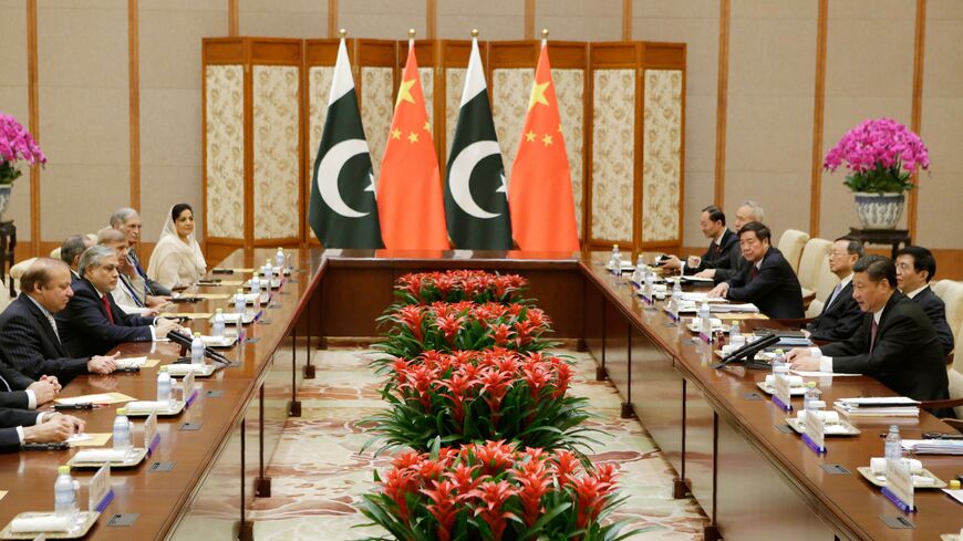Pakistan's Prime Minister Nawaz Sharif (L) talks with China's President Xi Jinping (R), ahead of the Belt and Road Forum, in Beijing on May 13, 2017. / AFP PHOTO / POOL / JASON LEE (Photo credit should read JASON LEE/AFP via Getty Images)