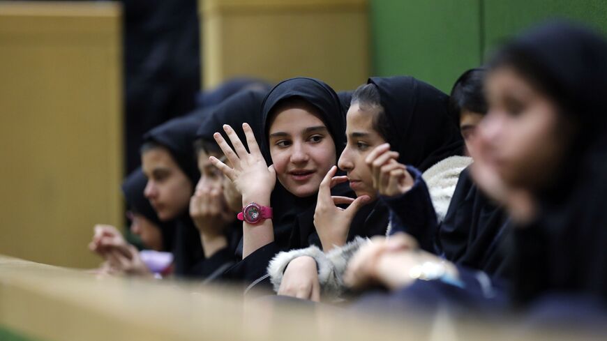 Iranian school-girls attend President Rouhani's presentation of the for 2018-2019 budget to the parliament on December 10, 2017, in Tehran. / AFP PHOTO / ATTA KENARE (Photo credit should read ATTA KENARE/AFP via Getty Images)