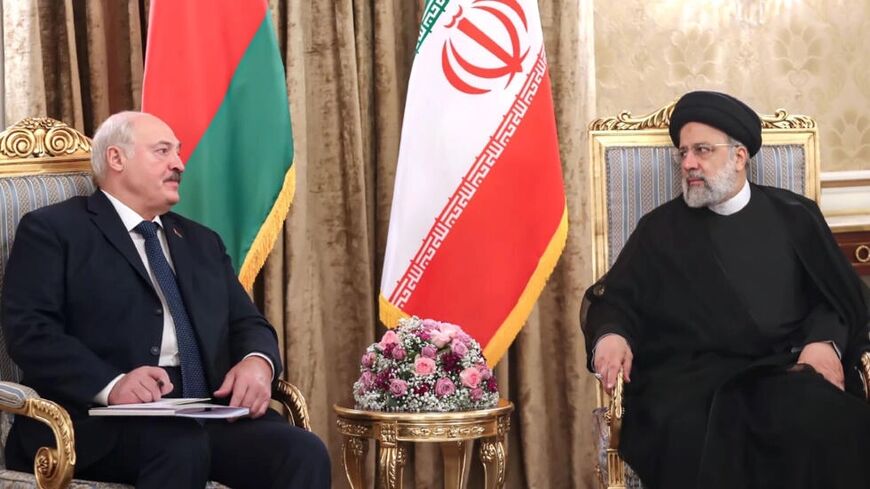 Lukashenko (L) meeting Raisi in Tehran.jpg