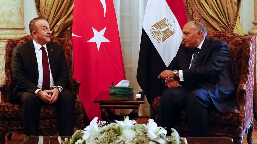 Turkish Foreign Minister Mevlut Cavusoglu (L) holds Cairo talks with Egyptian counterpart Sameh Shoukry as the two governments move to repair ties