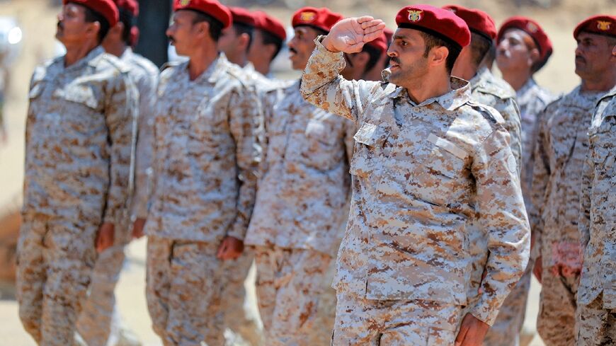 Fighters loyal to Yemen's Saudi-backed government take part in a parade during a graduation ceremony of officers in the northeastern province of Marib on March 17, 2023