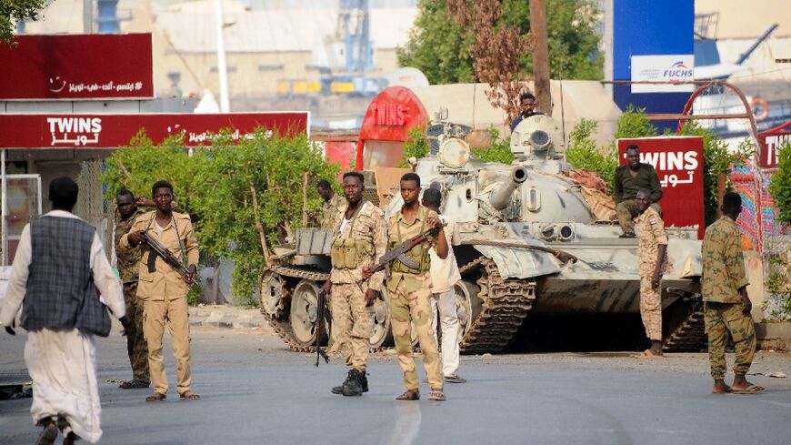 Sudanese army soldiers, loyal to army chief Abdel Fattah al-Burhan, man a position in the Red Sea city of Port Sudan