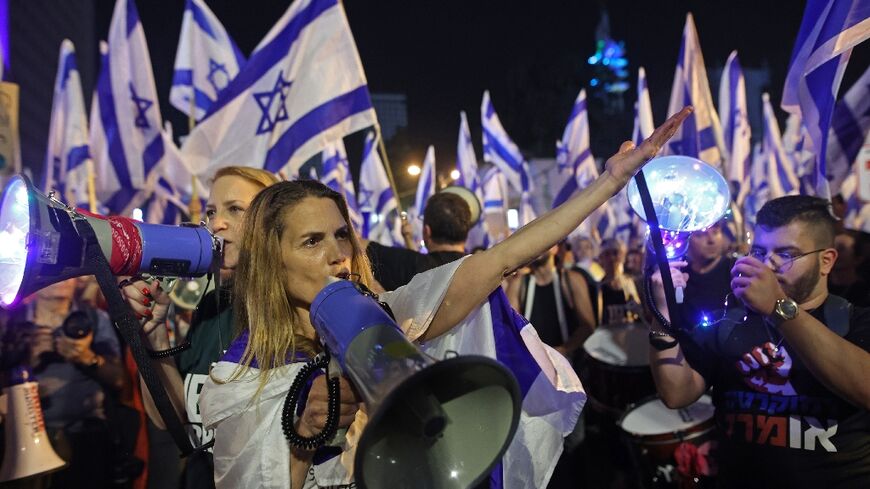 Protesters demonstrate against the government's judicial reform proposals in Tel Aviv 