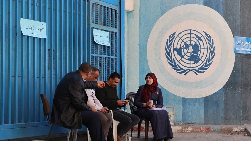 Palestinian teachers sit in front of the headquarters of the United Nations Relief and Works Agency for Refugees (UNRWA) in Gaza City during a general strike of employees in UNRWA institutions in the Palestinian strip, on November 29, 2021. (Photo by Mohammed ABED / AFP) (Photo by MOHAMMED ABED/AFP via Getty Images)