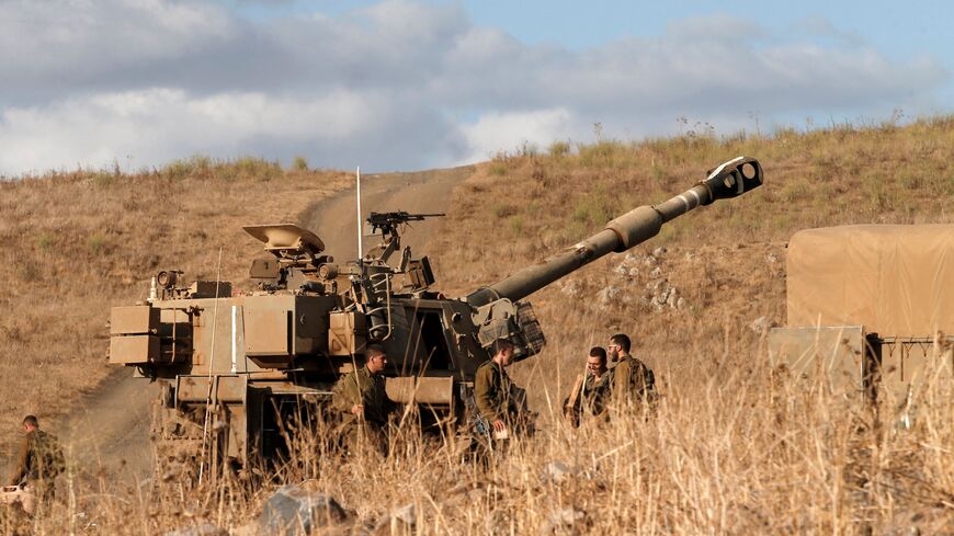 Israeli soldiers take part in a military exercise near the town of Katzrin, in the Israeli-annexed Golan Heights on the border with Syria, on September 21, 2022. (Photo by JALAA MAREY / AFP) (Photo by JALAA MAREY/AFP via Getty Images)