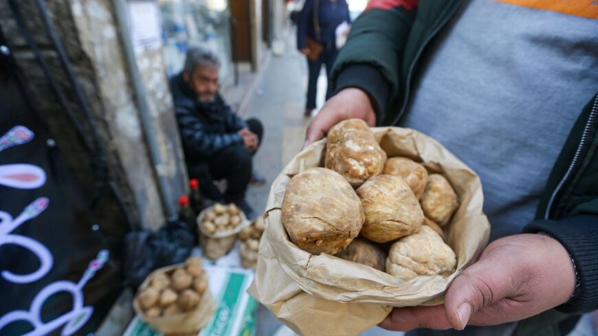 A vendor arranges truffles at his road side stall in Damascus on March 1, 2023. 