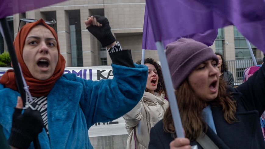 Women chant slogans in front of the Istanbul courthouse in Istanbul on April 5, 2023, as We Will Stop Femicides Platform, leading women rights group in Turkey appear on court for the second hearing of the trial that seeks to ban the platform. 