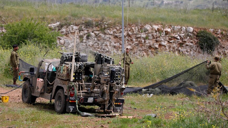 Israeli soldiers deploy in an open area near Kibuttz Malkia, in northern Israel bordering Lebanon, on April 7, 2023. - On April 6, the Israeli army said more than 30 rockets had been fired from Lebanese territory into Israel in the largest escalation on the northern border since Israel and Hezbollah fought a 34-day war in 2006. (Photo by JALAA MAREY / AFP) (Photo by JALAA MAREY/AFP via Getty Images)