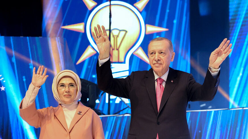 Turkish President and Leader of the Justice and Development (AK) Party, Recep Tayyip Erdogan (R) and his wife Emine Erdogan (L) acknowledge the crowd during the unveiling of the AK Party's Election Manifesto in Ankara, Turkey on April 11, 2023. 