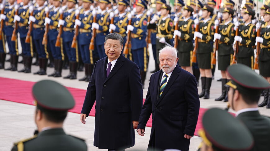 Brazilian President Luiz Inacio Lula da Silva (R) inspects an honor guard with Chinese President Xi Jinping during a welcome ceremony held outside the Great Hall of the People on April 14, 2023 in Beijing, China.