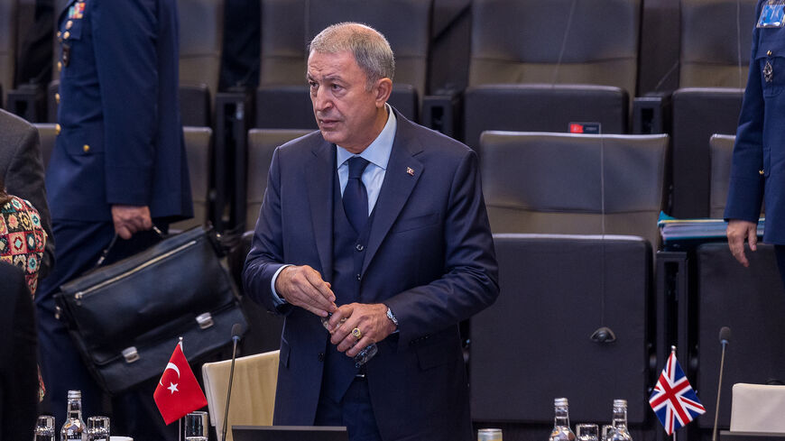 Turkish Defence Minister Hulusi Akar is seen standing at the start of the North Atlantic Council meeting of defence ministers during the second and final day of the NATO defence ministers' meeting at the NATO headquarters on October 13, 2022 in Brussels, Belgium. The North Atlantic Council (NAC) Defence Ministers are convening at the NATO headquarters in Brussels for a two-day summit as the war in Ukraine continues into its seventh month. (Photo by Omar Havana - Pool / Getty Images)