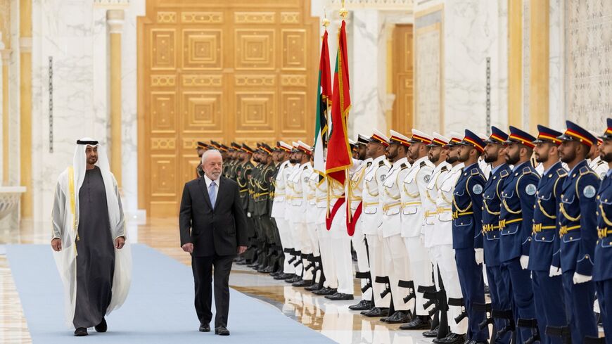 This handout image provided by the UAE's Presidential Court on April 15, 2023, shows UAE President Sheikh Mohamed bin Zayed al-Nahyan and Brazil's President Luiz Inacio Lula da Silva in Abu Dhabi 