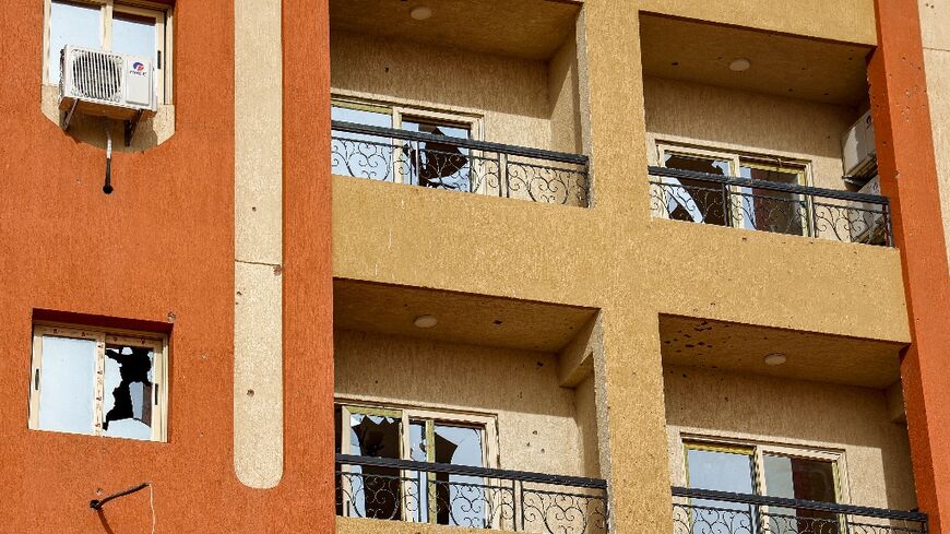 Broken windows at a residential building in Khartoum in the aftermath of fighting