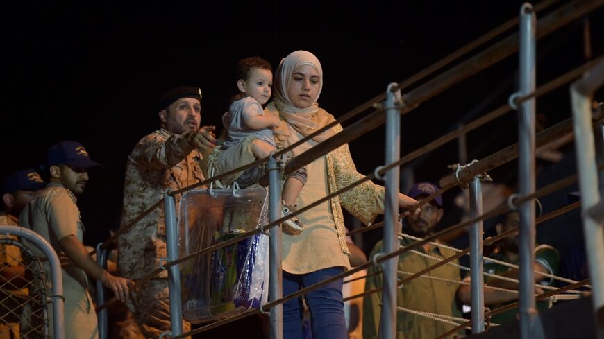 Nearly 200 people from more than 20 countries disembarked from a naval frigate in the Saudi city of Jeddah Monday night after a daring escape from Sudan