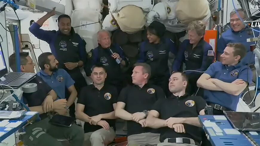 The four Axiom Mission 2 astronauts -- Peggy Whitson, John Shoffner, Ali Al-Qarni and Rayyanah Barnawi -- gather for a greeting ceremony with the rest of the crew aboard the International Space Station 