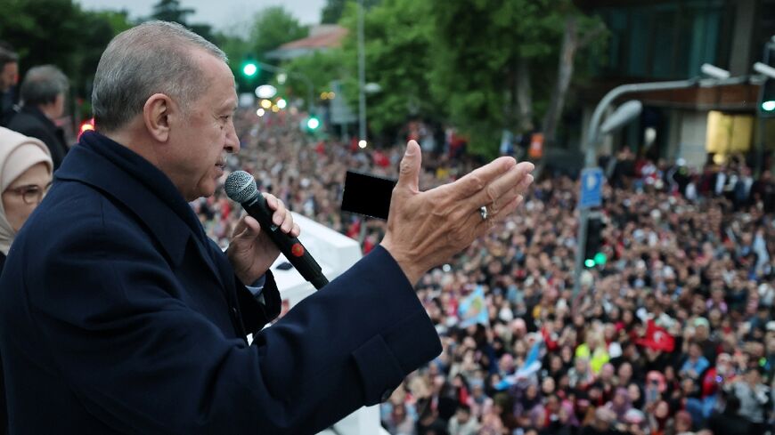 Turkish President Recep Tayyip Erdogan led his supporters in song after winning the toughest election of his rule