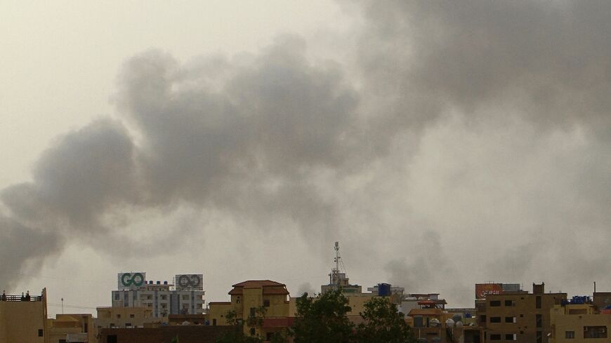 Smoke billows over buildings in southern Khartoum on May 29, 2023, amid ongoing fighting between the forces of two rival generals