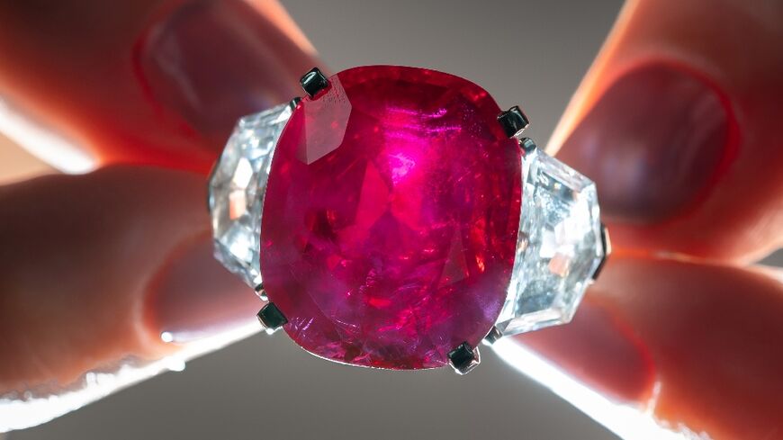 A Cartier ruby and diamond ring is expected to fetch at least $14 million at the auction in Geneva