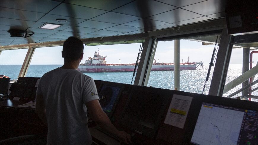 Crew from the support vessel Ndeavor spy the abandoned oil tanker FSO Safer near the coast of Yemen in a handout photo from Dutch company Boskalis 