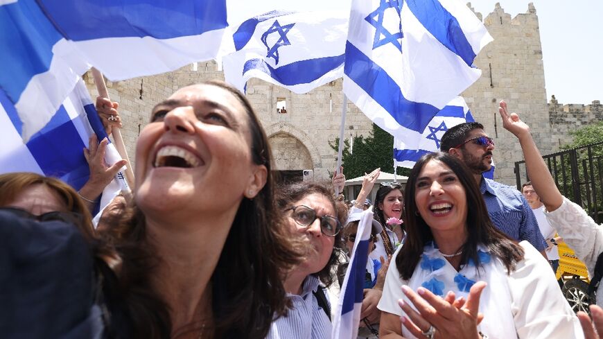 Transport Minister Miri Regev (R) was among Israelis waving flags at Damascus Gate in Jerusalem's Old City hours before the rally