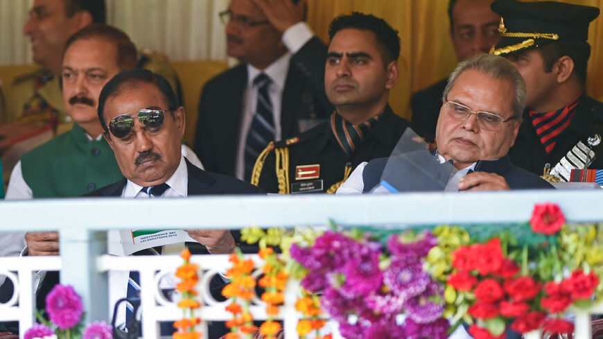India's National Security Advisor Ajit Doval (L) and Jammu and Kashmir state governor Satya Pal Malik (R) attend a ceremony to celebrate India's 73rd Independence Day, which marks the end of British colonial rule, in Srinagar on August 15, 2019. (Photo by Tauseef MUSTAFA / AFP) (Photo credit should read TAUSEEF MUSTAFA/AFP via Getty Images)