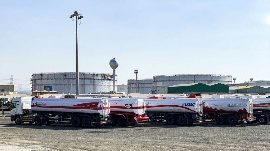 This picture  shows fuel trucks parked near silos at the Saudi Aramco oil facility in Saudi Arabia's Red Sea city of Jeddah, Nov. 24, 2020.
