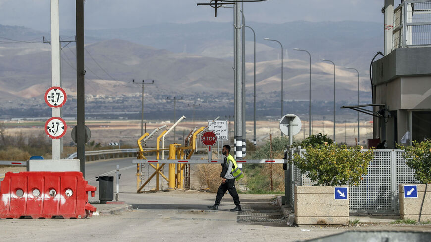 An Israeli security officer mans the control booth at the crossing point to Jordan (background), in the city of Jericho in the occupied West Bank, on January 28, 2021. - The Allenby (King Hussein) bridge crossing is due to be closed in the evening as part of restrictions to stem the spread of the COVID-19 pandemic. (Photo by AHMAD GHARABLI / AFP) (Photo by AHMAD GHARABLI/AFP via Getty Images)