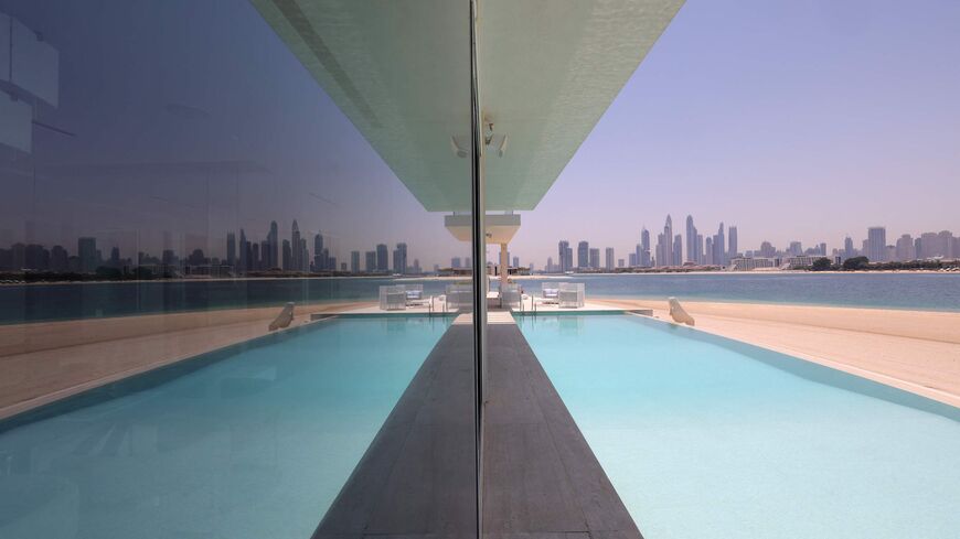 This picture shows the swimming pool of a luxury villa for sale on one of the Palm Jumeirah man-made island, on the coast of the Gulf emirate of Dubai, on May 19, 2021. - Dubais property market is powering out of a six-year malaise as "lockdown dodgers" and wealthy international investors drive a buying frenzy that is breaking records and fuelling an economic recovery. Luxury villas are the hottest segment in the market, with European buyers in particular seeking homes on Dubais signature Palm Jumeirah man-