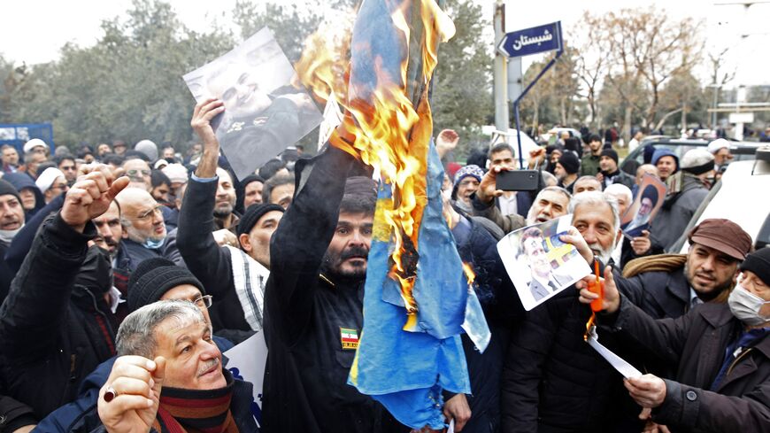 Iranians burn a Swedish flag during a protest in Tehran on January 27, 2023 against the burning of a Koran in Stockholm. - Swedish-Danish far-right politician Rasmus Paludan set fire to a copy of the Muslim holy book in front of Turkey's embassy in the Swedish capital. Many Muslim countries have said they were outraged by the burning of the Koran, which Swedish Prime Minister Ulf Kristersson condemned as "deeply disrespectful". (Photo by AFP) (Photo by STR/AFP via Getty Images)