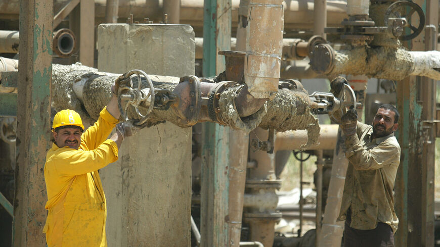 Workers at the Northern Oil Company carry out maintenance work at the pumping station in the northern Iraqi city of Kirkuk.